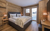 Schlafbereich mit edler Einrichtung aus Naturmaterialien - Ihr Holz-Chalet am Arlberg